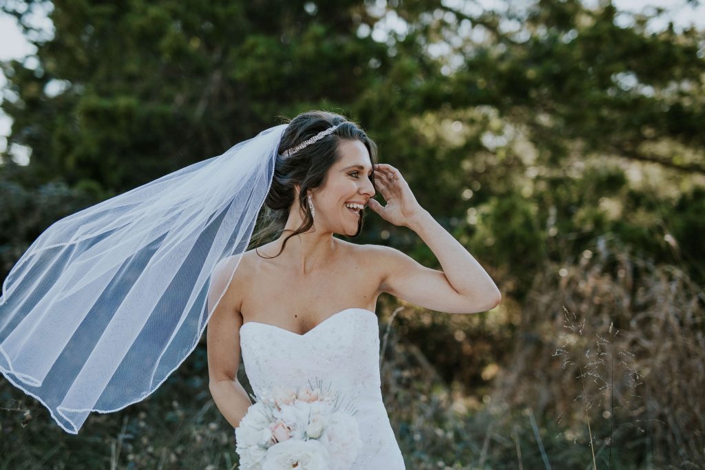 A bride in a strapless wedding dress; photo credit: Brooke Cagle, Unsplash