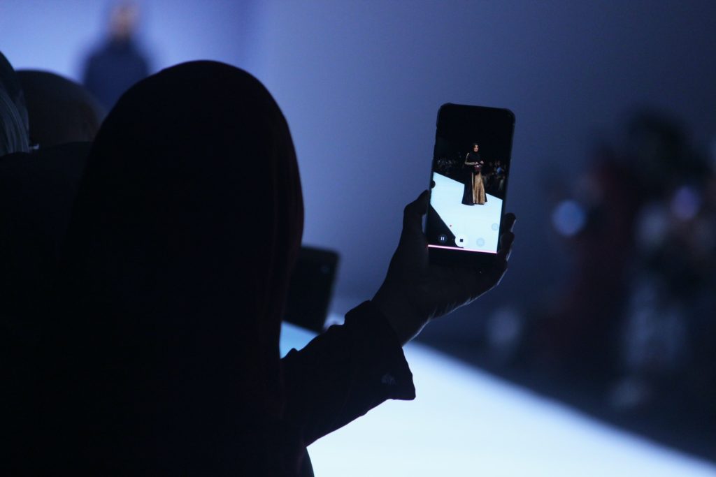 Fashion Journalist At A Runway Show