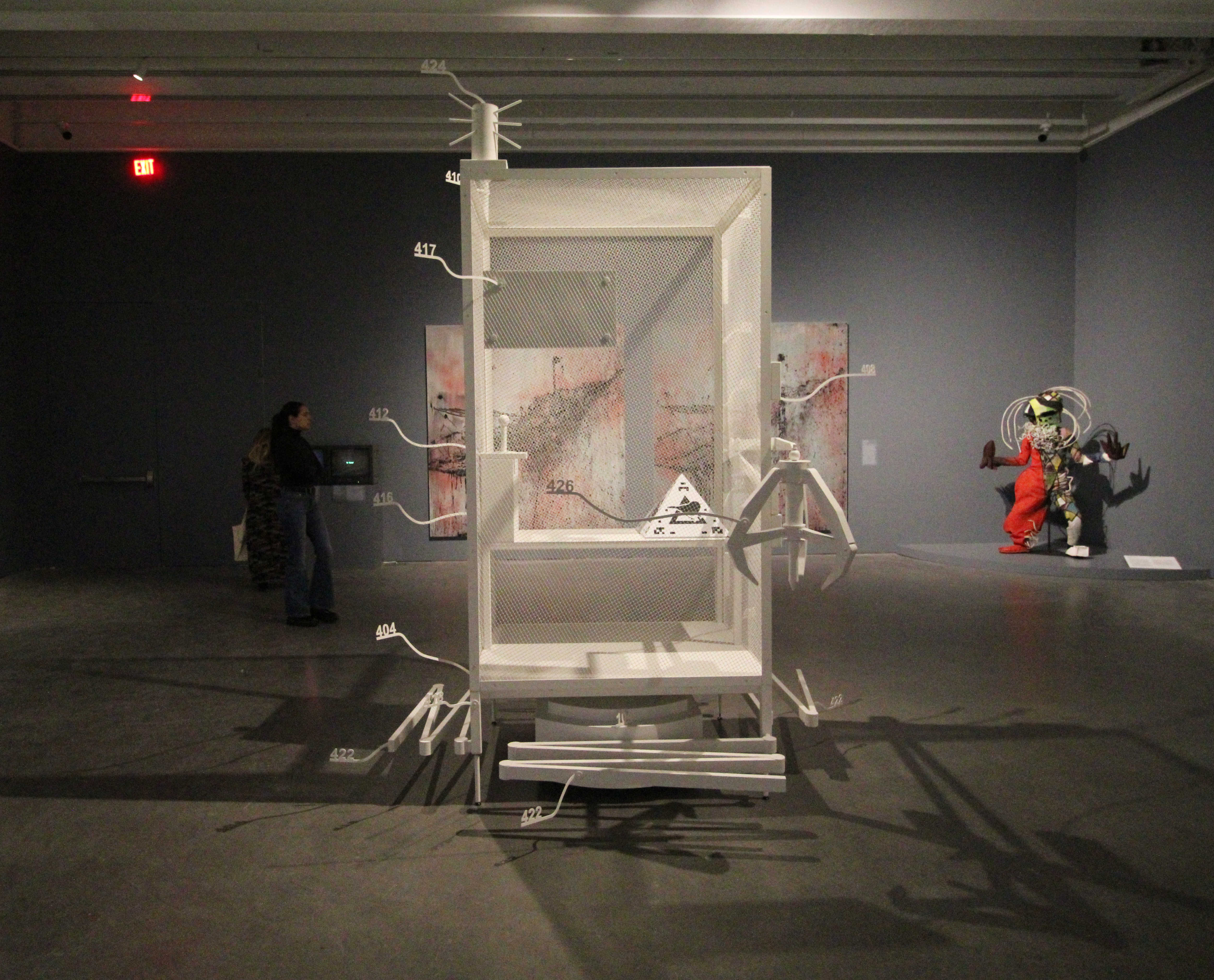 Simon Denny - “Amazon worker cage patent drawing as virtual King Island Brown Thornbill cage (US 9,280,157 B2: “System and method for transporting personnel within an active workspace ,” 2016)”, 2019; photo © 2026 Manic Metallic