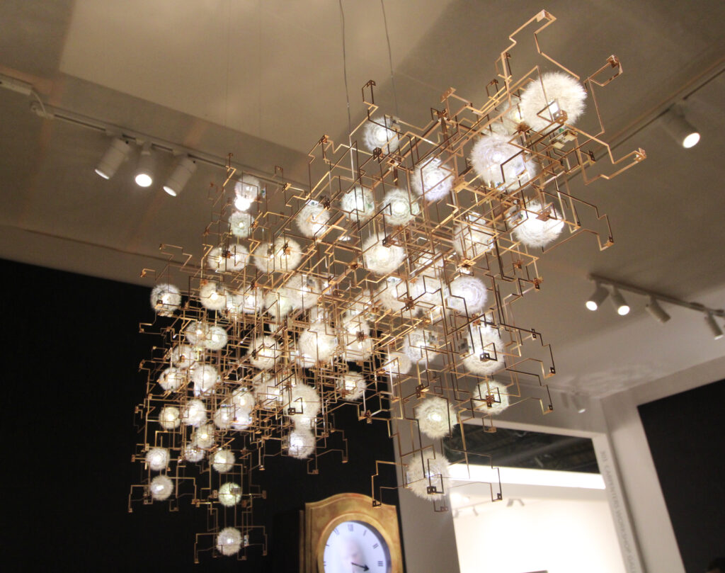 A dandelion seed chandelier by Drift, shot at the Carpenters Workshop Gallery booth; photo: Benjamin Imhoff for Manic Metallic